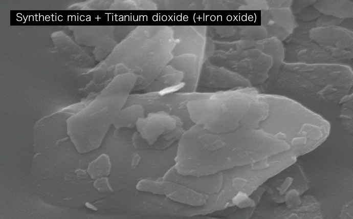 Synthetic mica + Titanium dioxide (+Iron oxide)